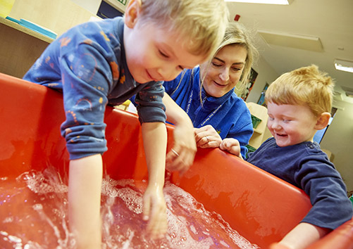 boy playing with water